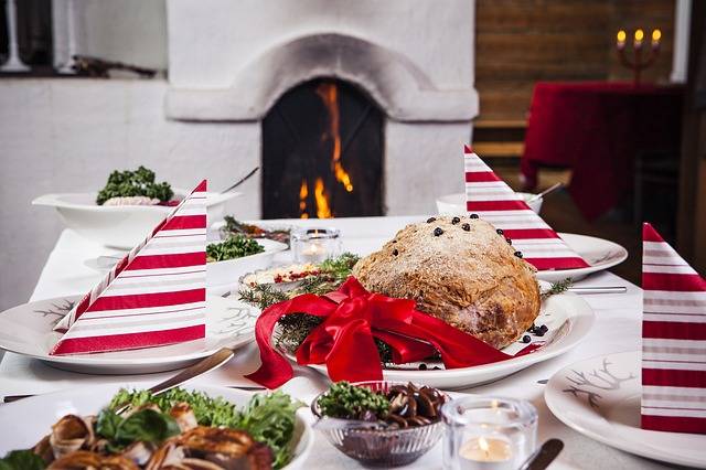 a dining table decorated for christmas