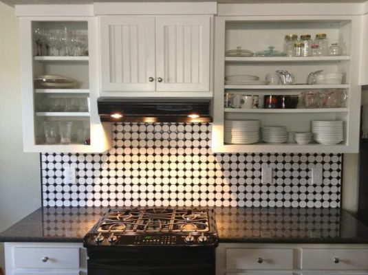 White kitchen cabinets with LED lights underneath