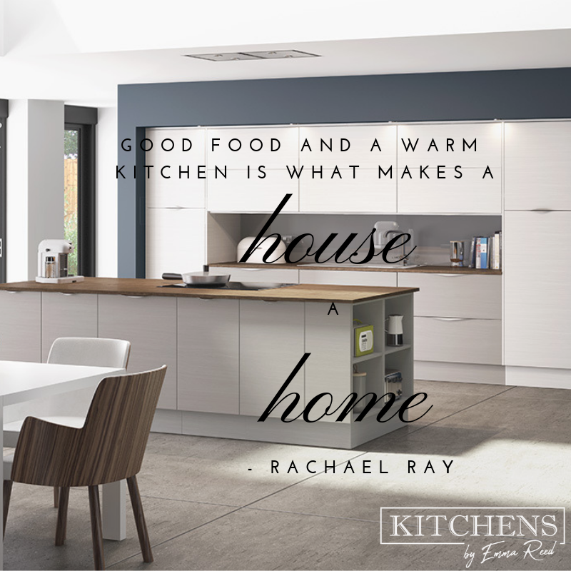 A sleek kitchen with an island and a table and chairs