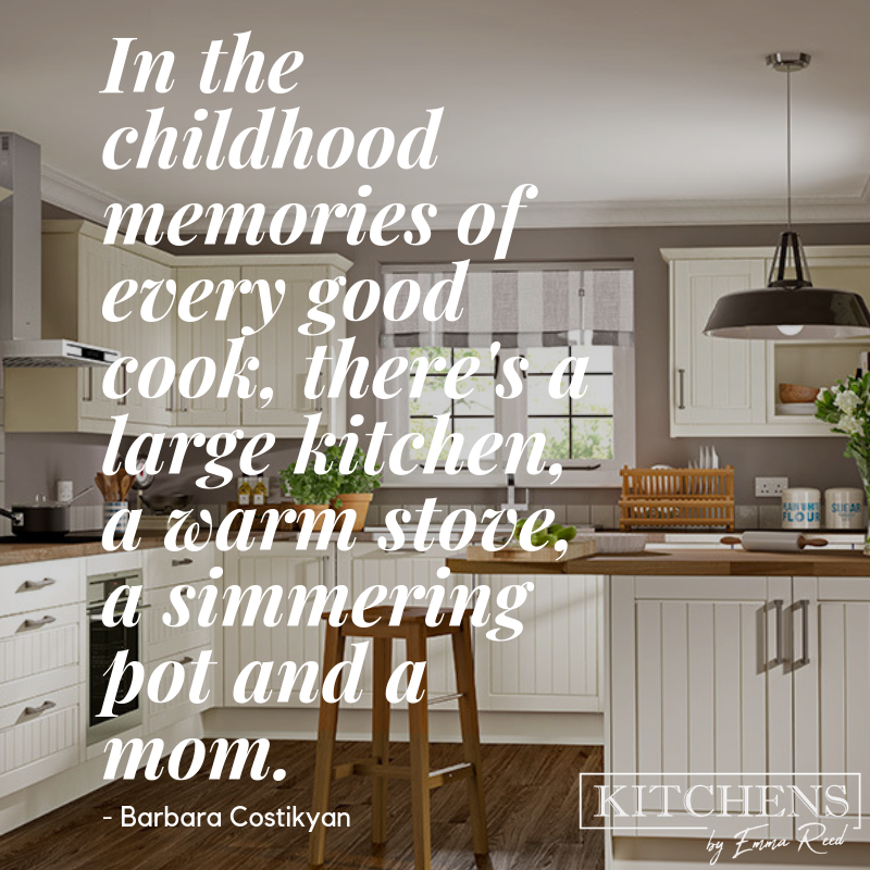 A white kitchen with wood worktops