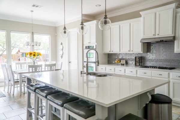 white kitchen with big worktops