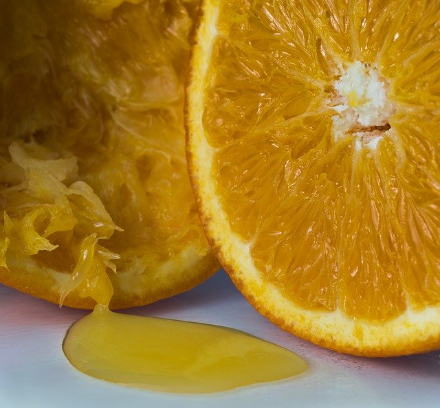 juice leaking out of an orange