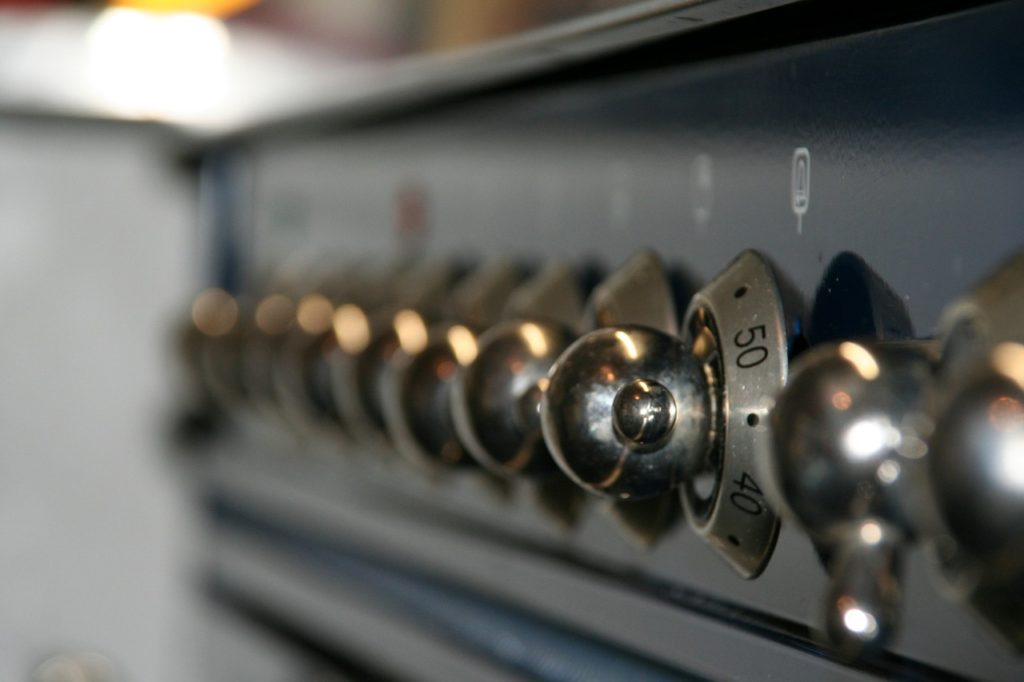close up of the dials on a cooker