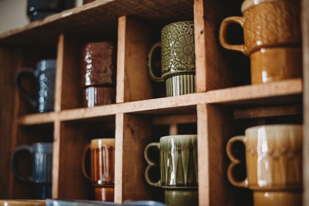 mugs on a kitchen shelf to represent how to organise a small kitchen