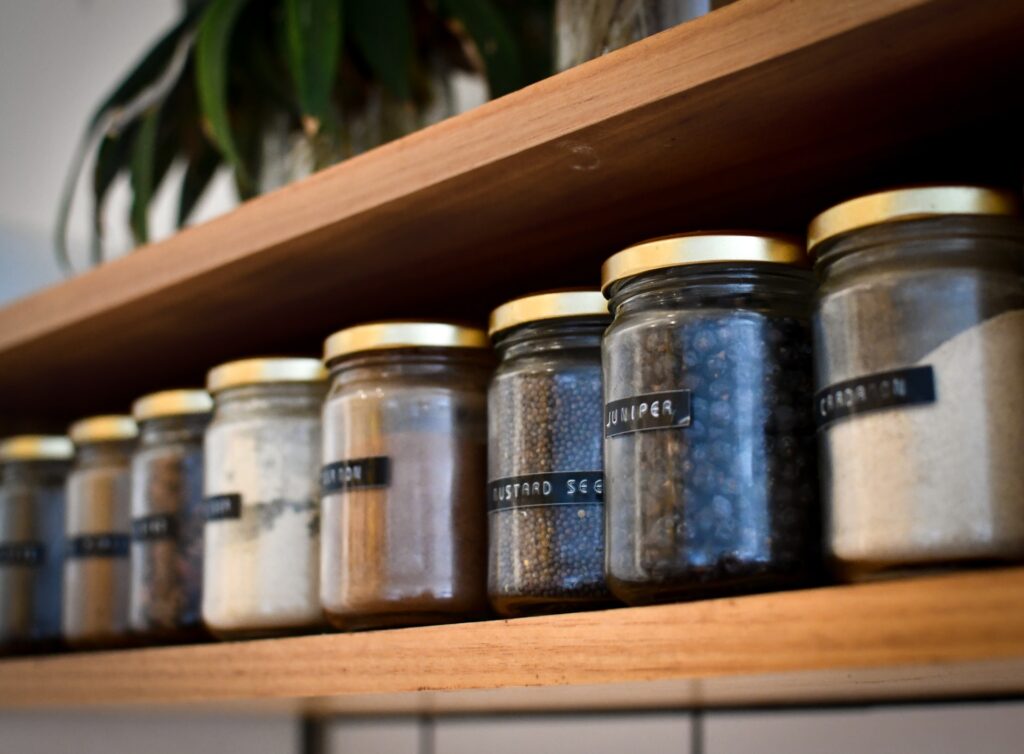 spices on a shelf to represent how to organise a small kitchen